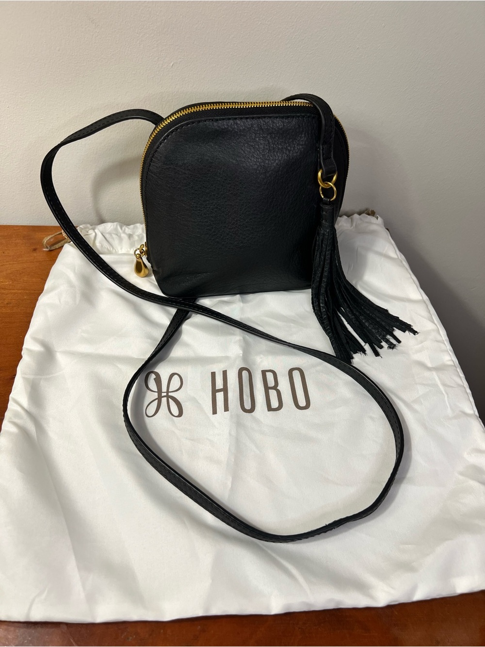 HOBO Black Pebbled Leather Nash Crossbody with Fringe Tassel and Gold Hardware